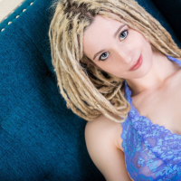 Maren Hill posing in Lingerie on the Couch