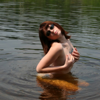 Naughty Girl B4rbi3 likes posing naked in a Lake
