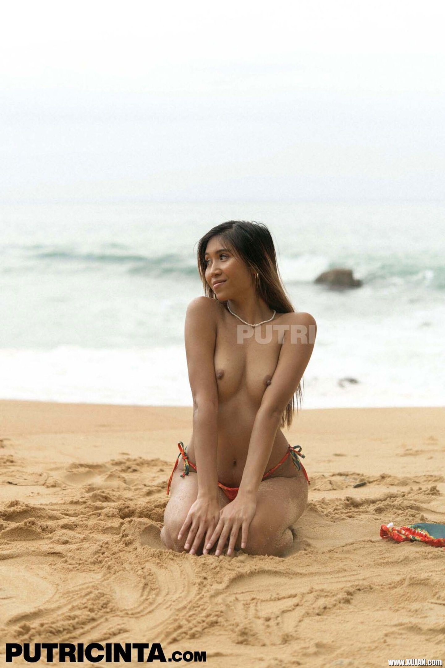 Lovely asian girl Kitty drops down her colorful bikini at the beach - Photo #3418271