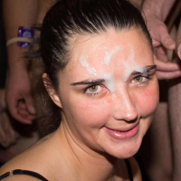 Adult woman receives huge facial cumshot at group orgy