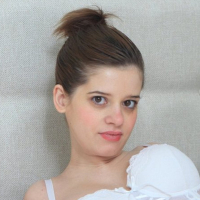 Pregnant Vicky using a Vibrator on her oily Tits