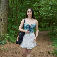 Busty brunette girl Remido revealing her naked melons in the park