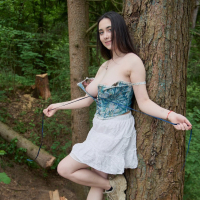 Busty brunette girl Remido revealing her naked melons in the park