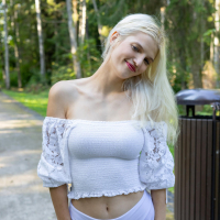 Playful blonde girl Roni strips naked and spreads wide open