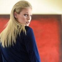 Blonde cutie Scarlet Red shows her natural tits and shaved slit
