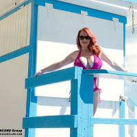 Red Vixen shows her Pussy and big Boobs on the Beach