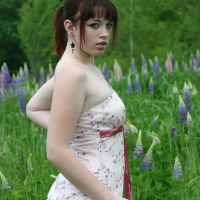Cute Model B4rbi3 enjoys posing in a green Field