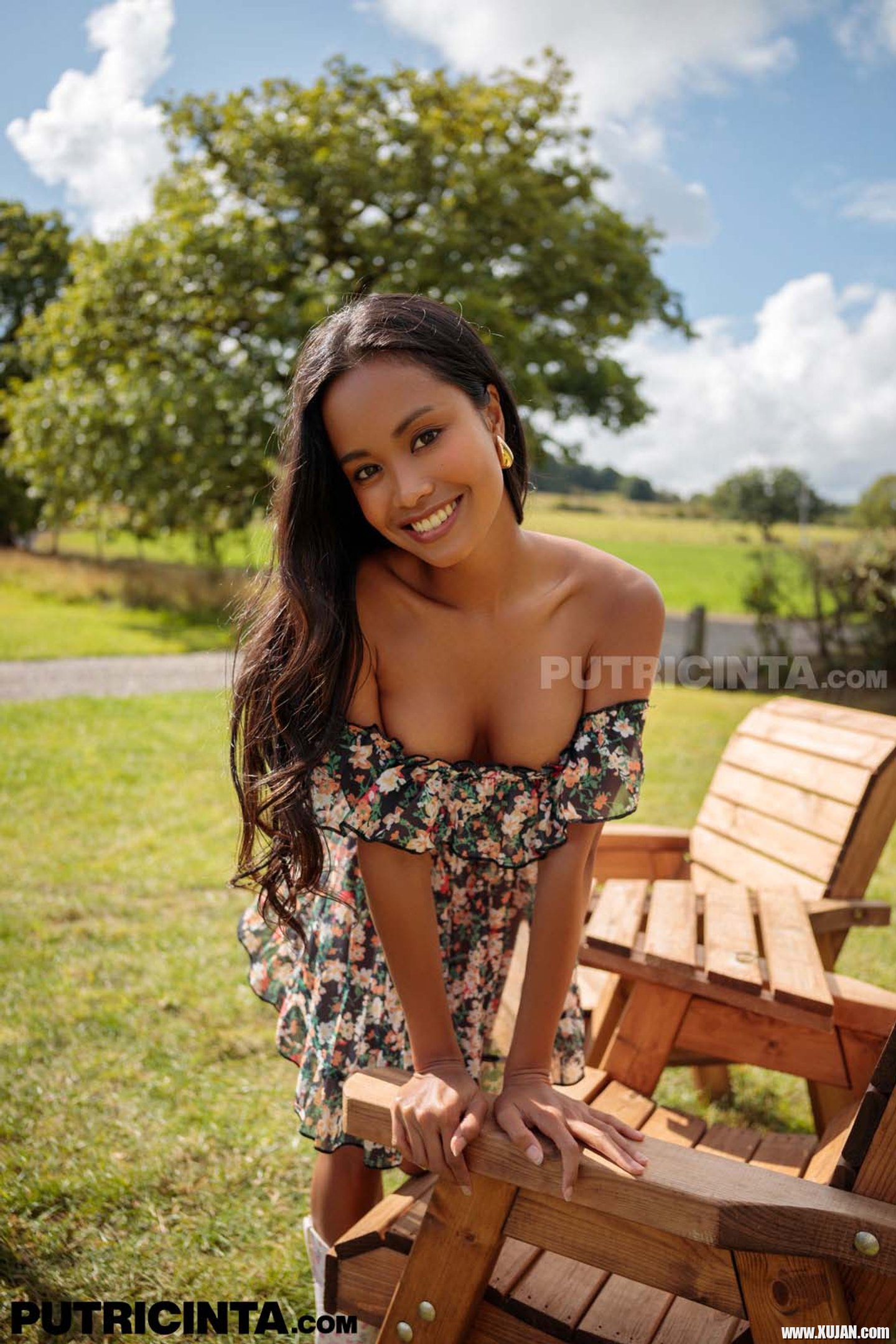 Putri Cinta has a dress that magically uncovers her tits at a BBQ - Photo #3440970
