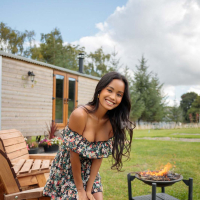 Putri Cinta has a dress that magically uncovers her tits at a BBQ