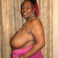 Sexy plump ebony woman Alize peels off pink dress then fucks