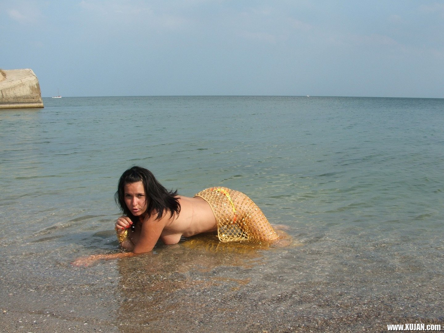 Naked Girl on the Beach cools down in the Ocean - Photo #3441398