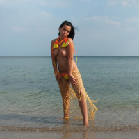 Naked Girl on the Beach cools down in the Ocean