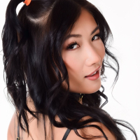 Naughty Asian Dolly Orchid pleasuring her puss with a black dildo