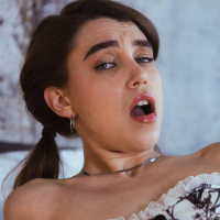 Elena Vedem lies back in her bed and uses a vibrator on her pussy