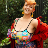 Naughty tattooed babe Sylvia Rose showing her big boobs in the backyard