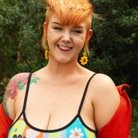 Naughty tattooed babe Sylvia Rose showing her big boobs in the backyard