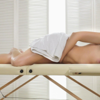 Lee Anne plays with vibrator on a massage table