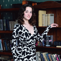 Nerdy girl Maribella loves reading and posing naked with her books