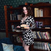 Nerdy girl Maribella loves reading and posing naked with her books