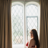Busty Brookie Little looking sexy in her bedroom