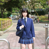 Naughty schoolgirl Tomomi Motozawa lifts up her skirt flashing panties