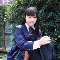 Naughty schoolgirl Tomomi Motozawa lifts up her skirt flashing panties