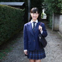 Naughty schoolgirl Tomomi Motozawa lifts up her skirt flashing panties