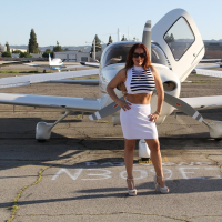 Hot Latina babe Nicky Ferrari behind the scenes of her plane ride
