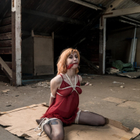 Ginger chick gets hogtied wearing red negligee