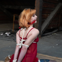 Ginger chick gets hogtied wearing red negligee