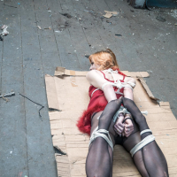 Ginger chick gets hogtied wearing red negligee