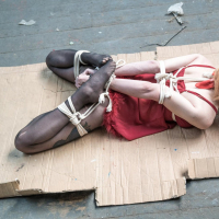 Ginger chick gets hogtied wearing red negligee
