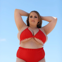 Hot Sara Willis drops down her sexy red bikini by the pool