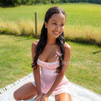 Putri Cinta has a picnic and shows her tits in the sunshine