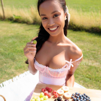 Putri Cinta has a picnic and shows her tits in the sunshine