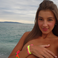 Solo babe Melena Maria Rya posing naked on the beach