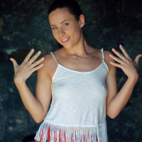 Dark haired Mara Blake rubs her shaved lovebox