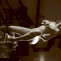 Lovely babe Julia teasing with her nice body on a table