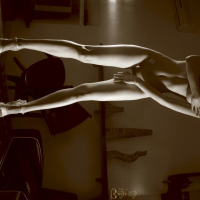 Lovely babe Julia teasing with her nice body on a table