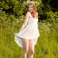 Sexy Babe Ginger Frost posing naked in a Meadow