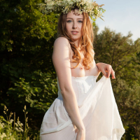 Sexy Babe Ginger Frost posing naked in a Meadow