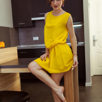 Erotic Babe Leona Honey removes her yellow Dress