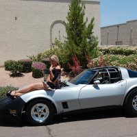 Sexy Porn Star Amy Brooke posing on a Corvette