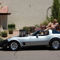 Sexy Porn Star Amy Brooke posing on a Corvette