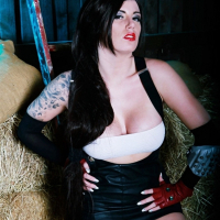 Yuffie Yulan toying her shaved pussy in a rustic stable