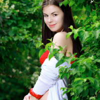 Karolina Young strips her red Underwear by a Bush