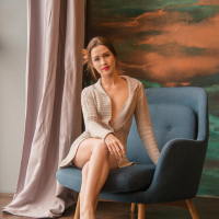Outstanding model Karolina Young poses in armchair
