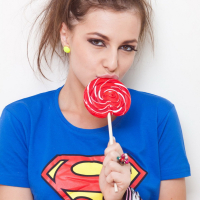 Superwoman Florina Rose licks Lollipop and strips