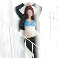 Slutty redhead babe Bree Daniels getting naked on a staircase