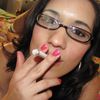 Latin teen babe Tia Cyrus smoking and masturbating pussy